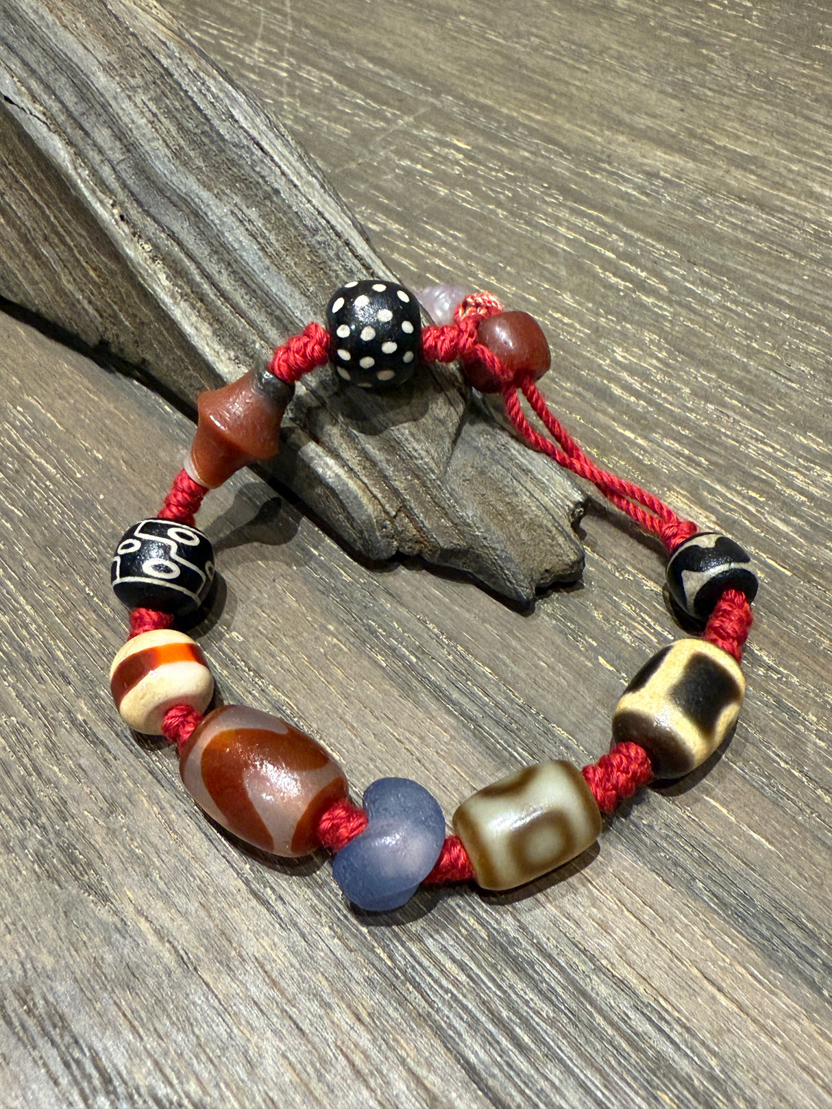 Red-Cord Agate Bracelet with Dzi Accents and Carved Charm