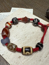 Red-Cord Agate Bracelet with Dzi Accents and Carved Charm