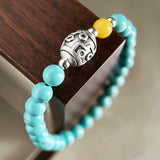 Tranquility & Wisdom – Turquoise & Lotus Mantra Bead Bracelet